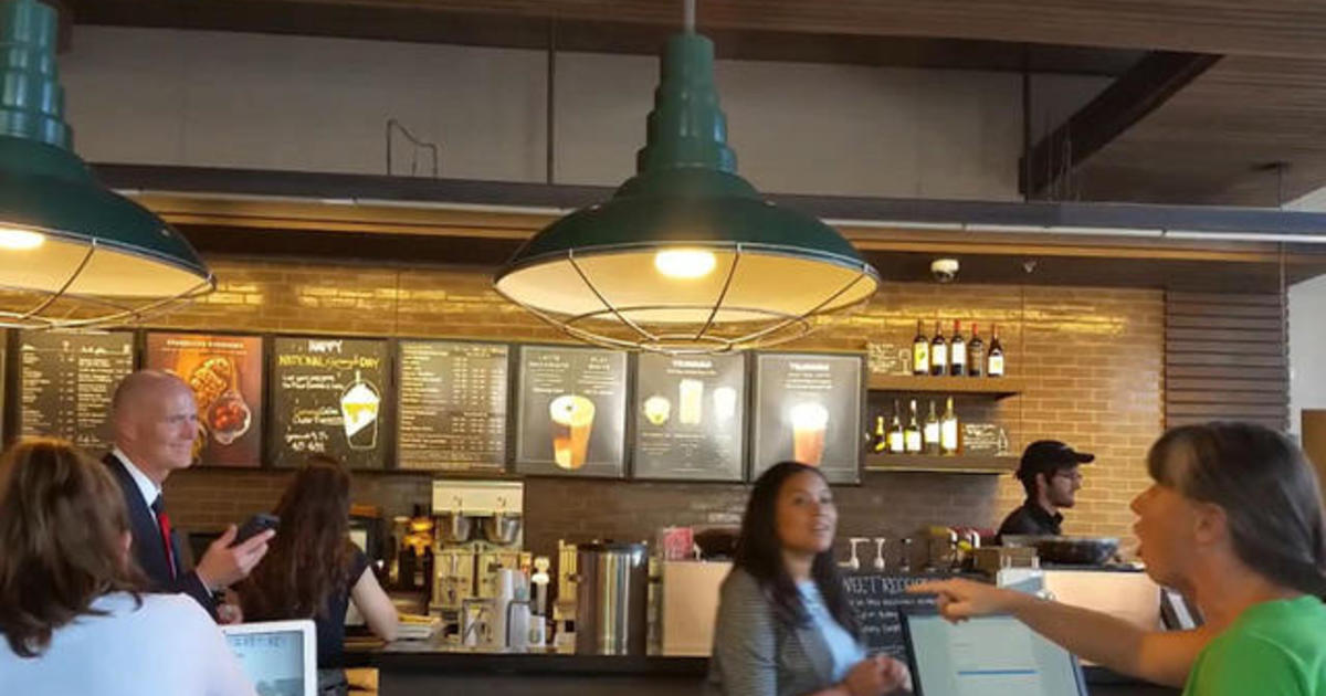 Woman reads the riot act to Fla. Gov. Rick Scott at coffee
stop 1
