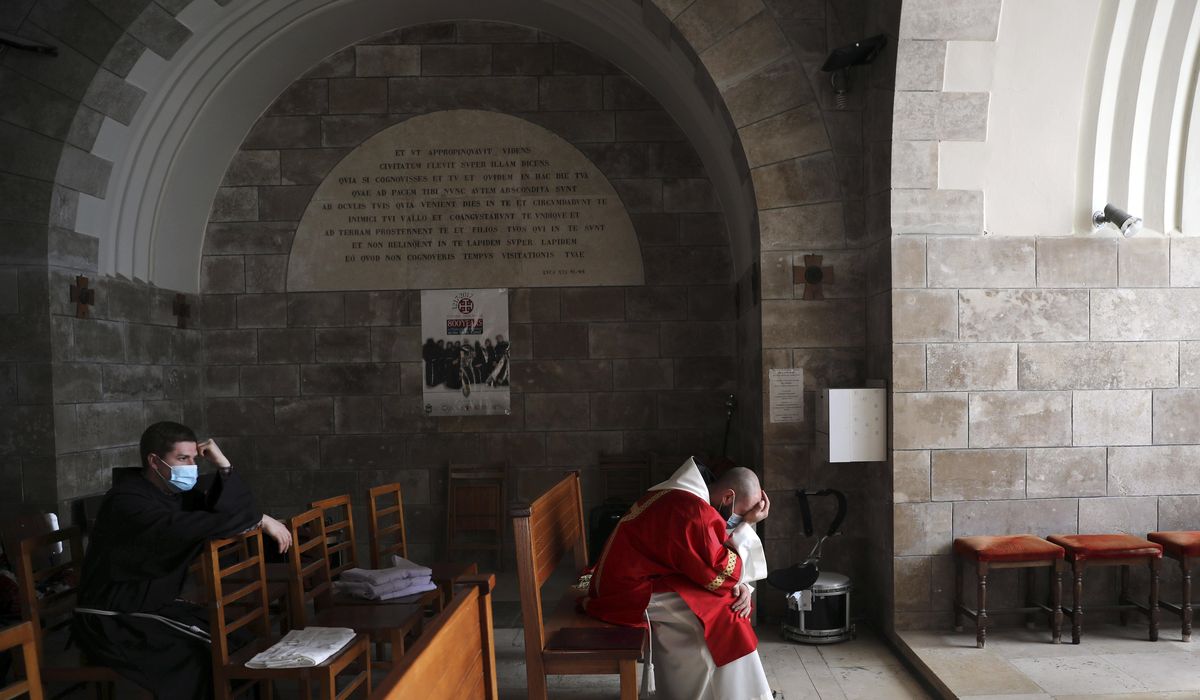 Christians mark Good Friday as holy sites gradually
reopen 1