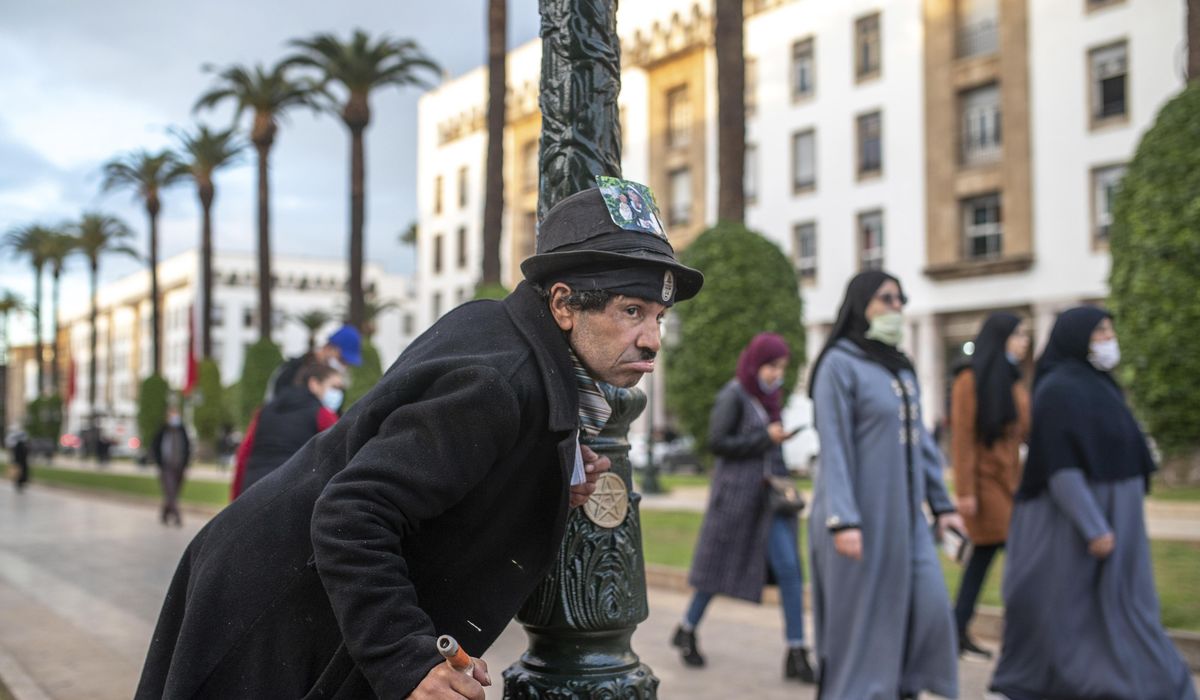 AP PHOTOS: Moroccan mimics Charlie Chaplin to mask
hardships 1