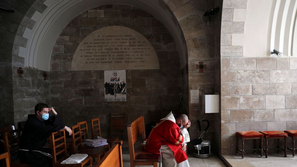 Christians mark Good Friday as some holy sites
reopen 1