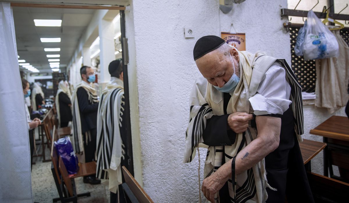 The Latest: Israel lifts public mask mandate, opens
schools 1