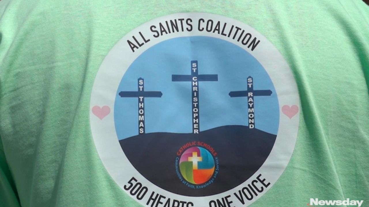 Parents, students, alumni protest closing of 3 Long
Island Catholic schools 1