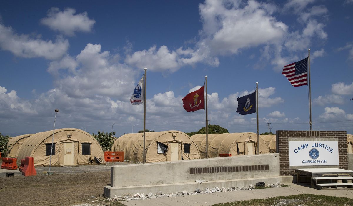 AP source: Guantanamo prisoners now getting COVID-19
vaccine 1