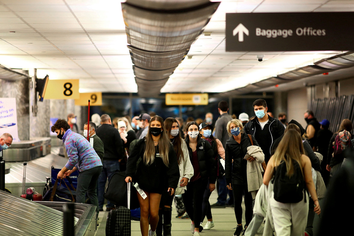 CDC says vaccinated people can travel but should still wear
masks 1