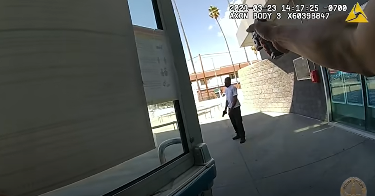 Video shows man with a fake gun outside LAPD Olympic station
before officer shoots him 1