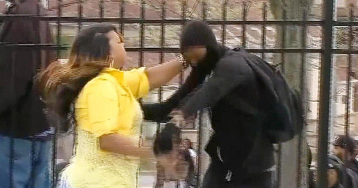 Angry mom grabs son off street amid Baltimore riot 1