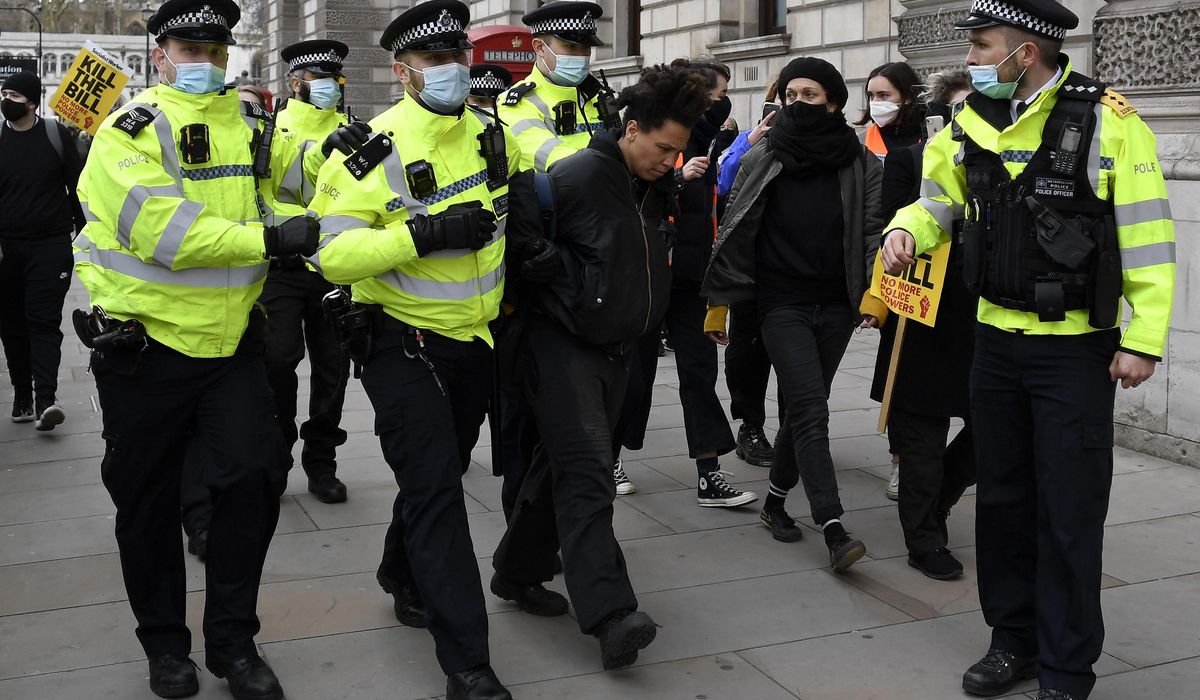 UK arrests over 100 in protests against policing
bill 1