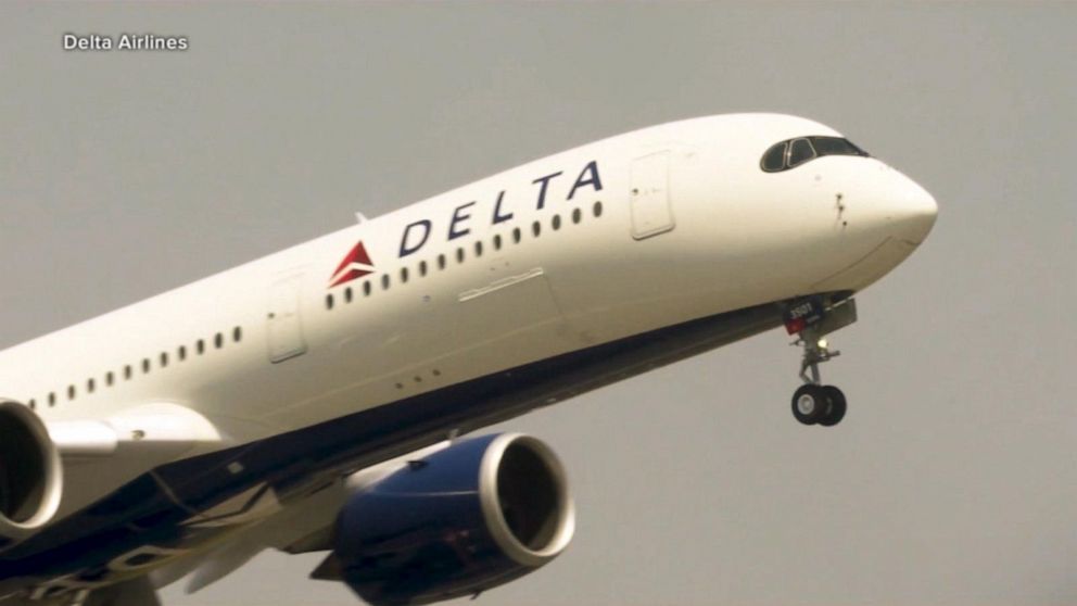 Delta cancels about 100 flights, opens some middle
seats 1