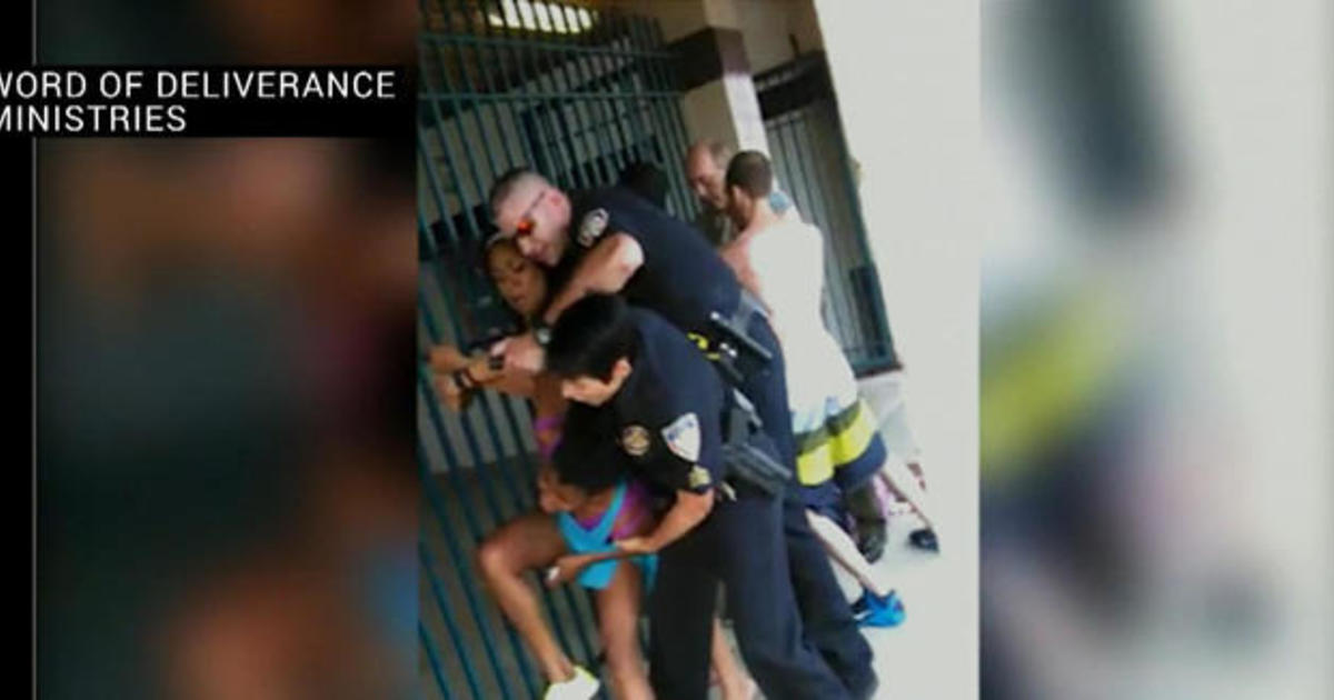 Officer accused of using excessive force to arrest swimmers
at pool 1