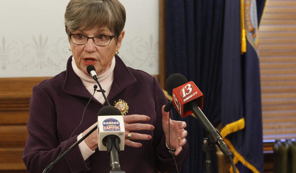 Kansas governor issues new but doomed statewide mask
policy 1