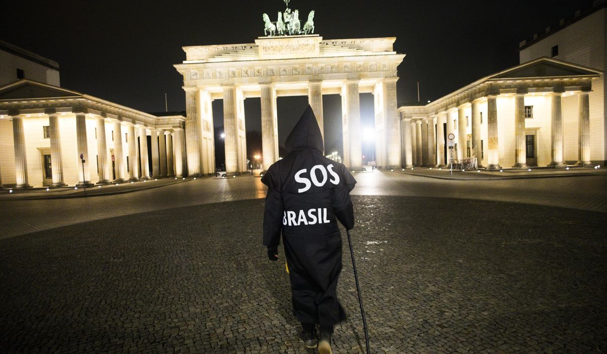 'Grim reaper' Berlin artist protests Brazil's virus
stance 1