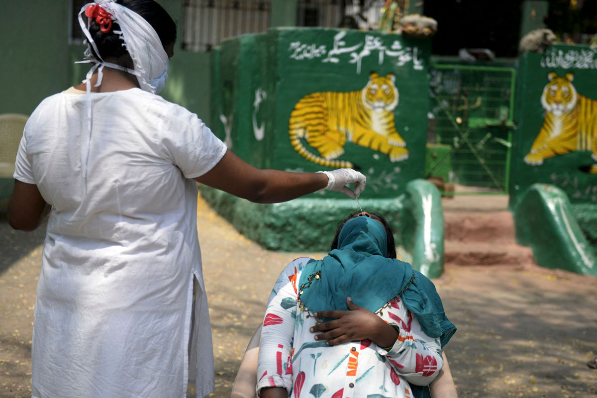 India surpasses 13 million Covid-19 cases after record daily
increase 1