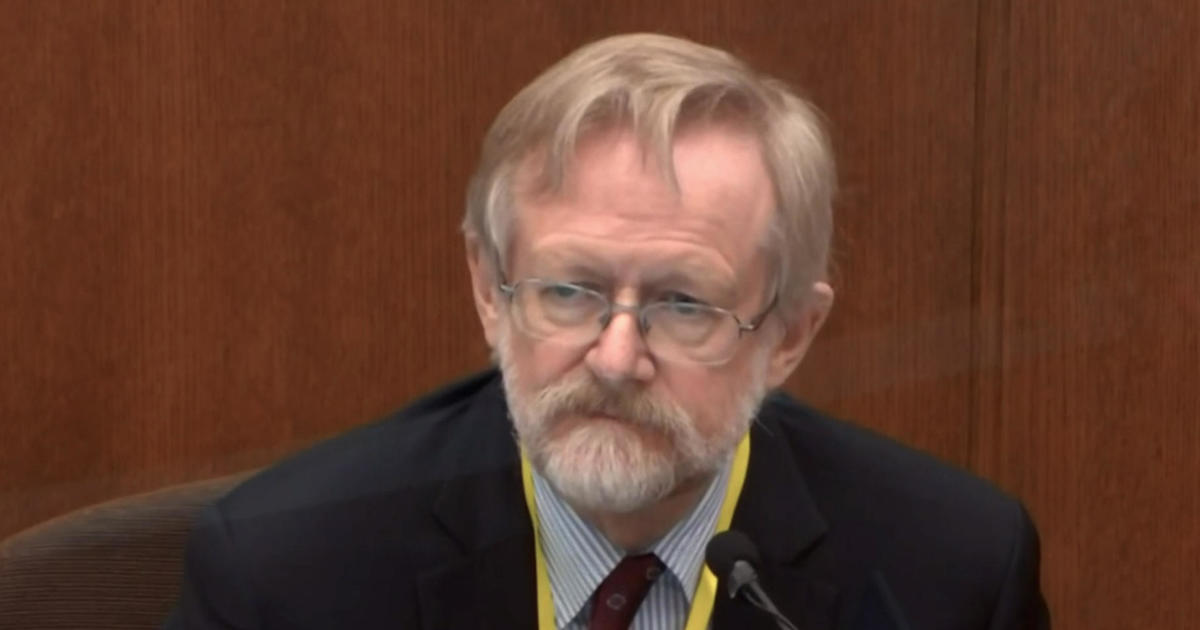 Doctor: Floyd died of low oxygen, caught in "vise" between
officers, street 1