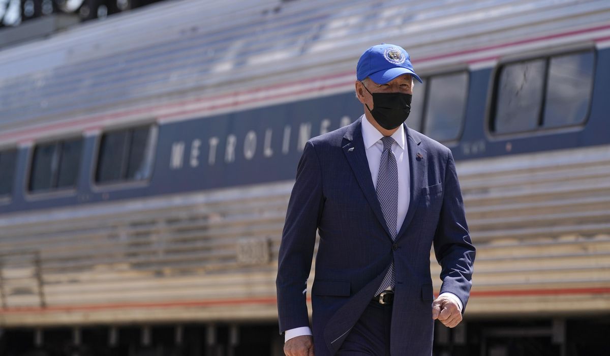 Adviser suggests Biden still wears mask outside out of
habit 1