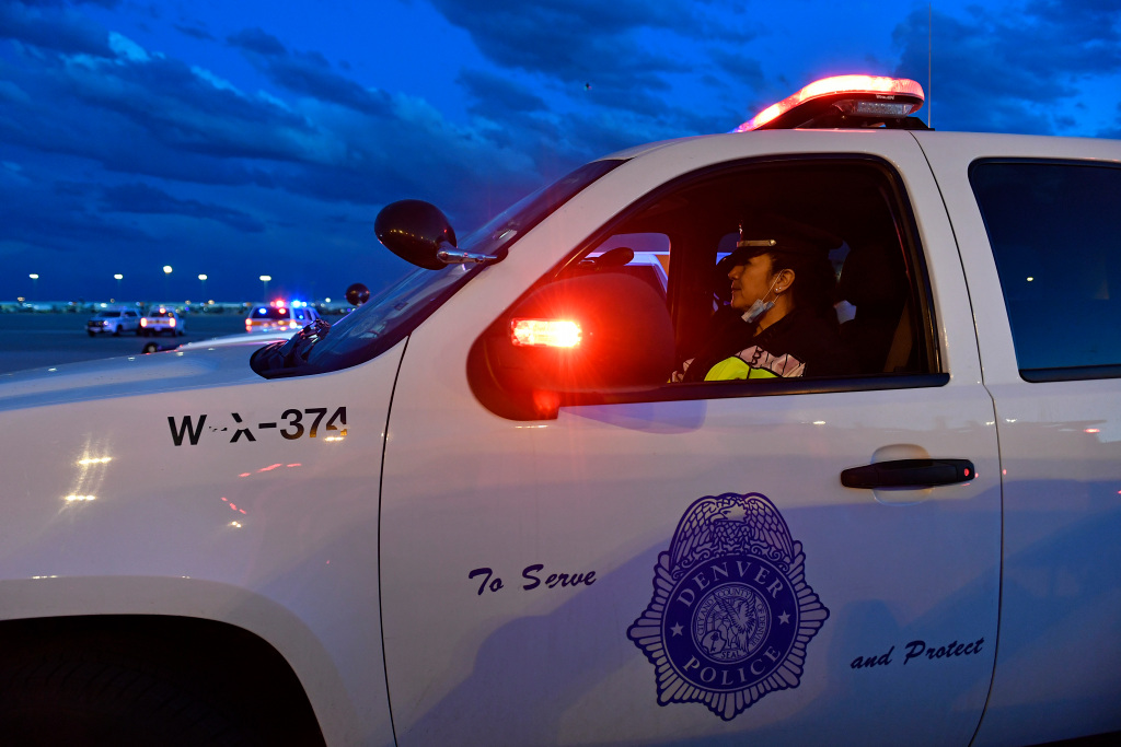 Man killed by Denver police after chase fired gun at
officers and strangers, officials say 1