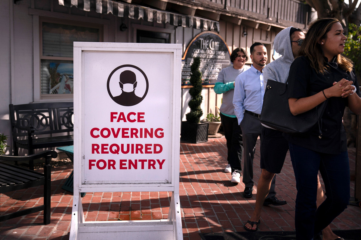 California will stay masked for another month 1