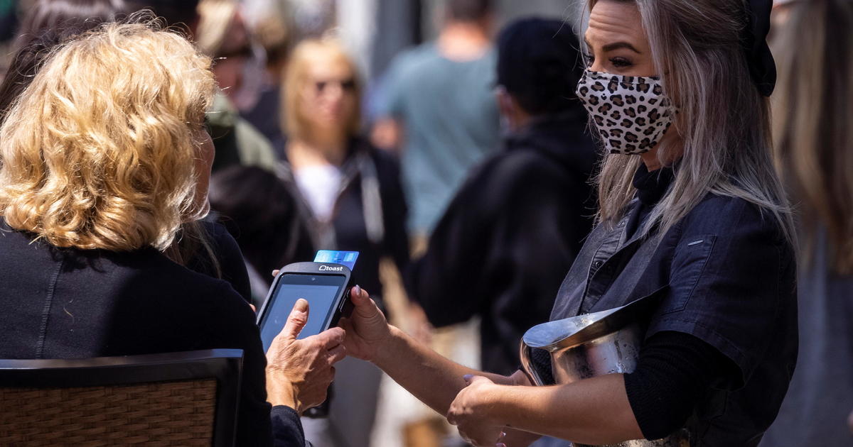 Nervous workers adjust to abrupt relaxation of mask
policies 1