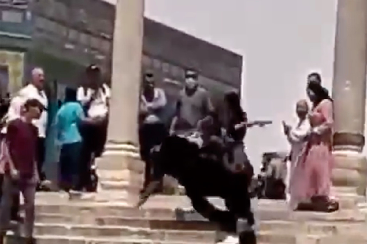 Video shows crowd cheering as Israeli officer is knocked off
his feet 1