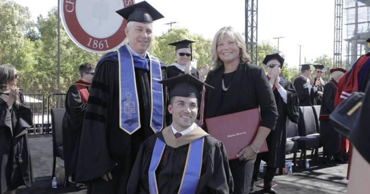 Mom receives honorary degree for attending all classes with
quadriplegic son 1