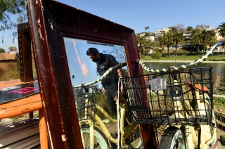 Sanitation workers collect 35 tons of trash while preparing
to reopen Echo Park Lake 1