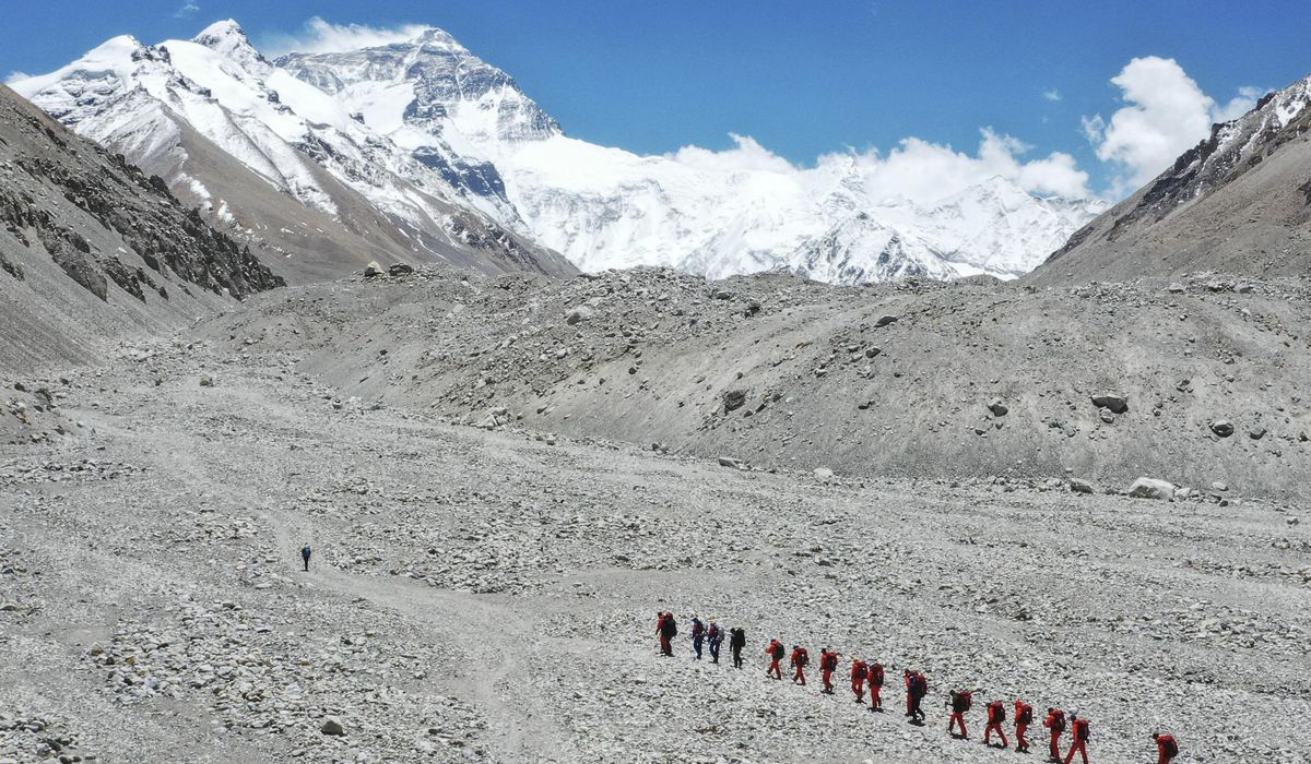 China opens Everest's north side to 38 virus-tested
climbers 1
