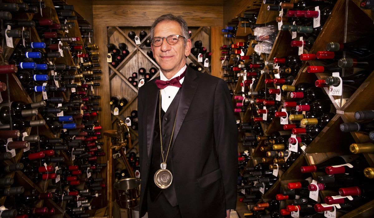 Vintage Vegas sommelier restocking wines for 100%
reopening 1