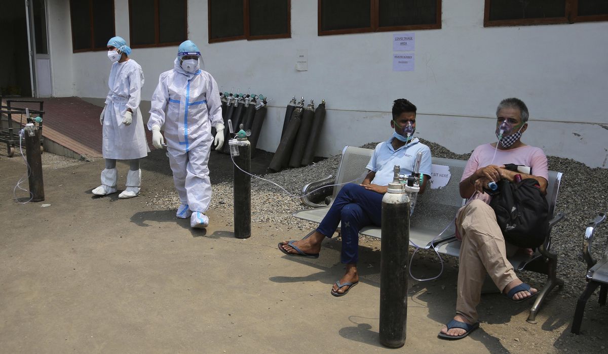 India's surge hits southern states, prompts more
lockdowns 1