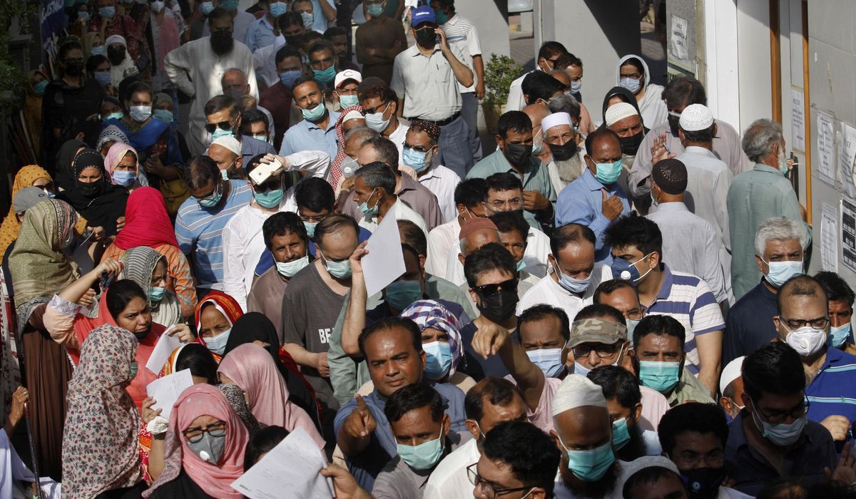 The Latest: Pakistanis shop ahead of weeklong
lockdown 1