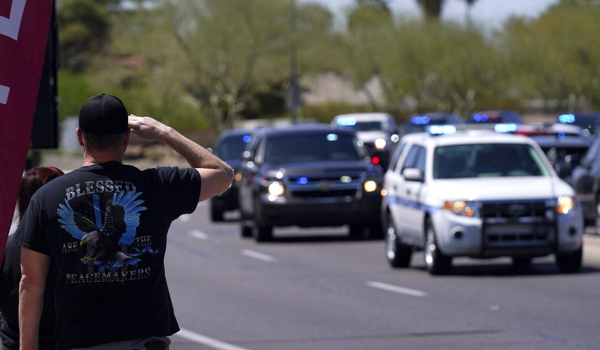 Speakers at service say fallen officer was caring,
giving 1