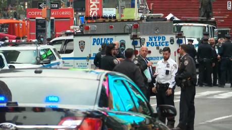 NYPD officer sprinted through Times Square to get a
4-year-old shooting victim to safety 1