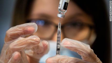 The US must vaccinate most of the country against Covid-19
by winter to avoid more variants, expert says 1