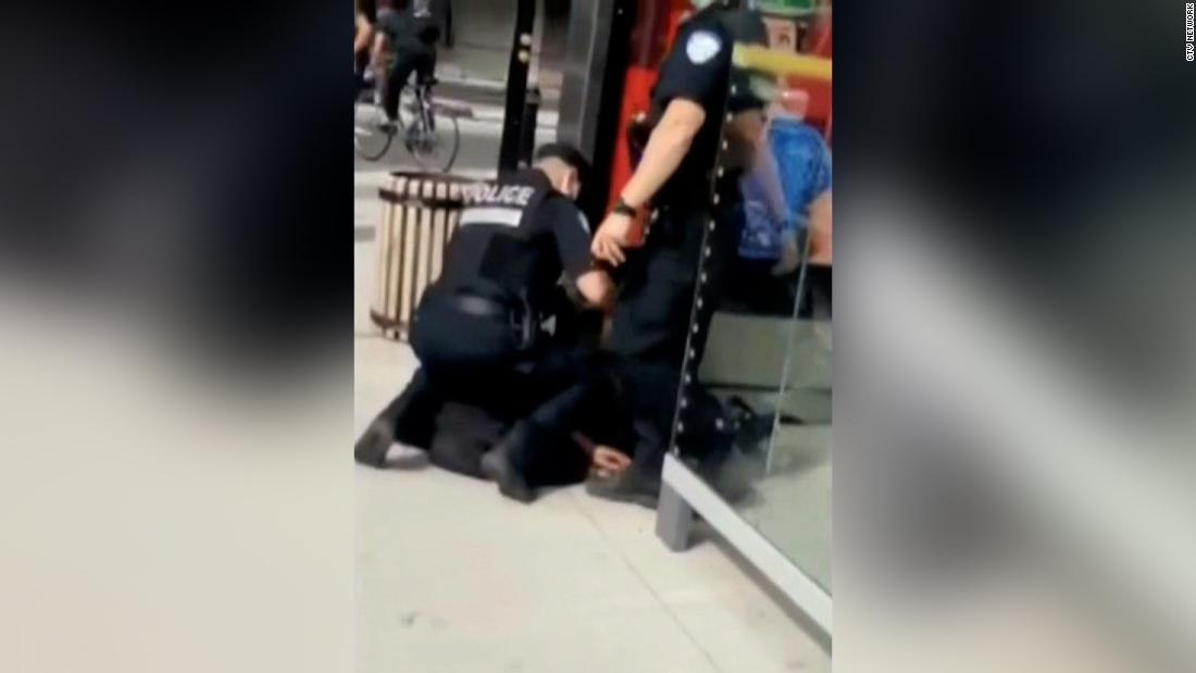 Canadian legislator calls for investigation into video of a
police officer kneeling on a teenager's neck 1