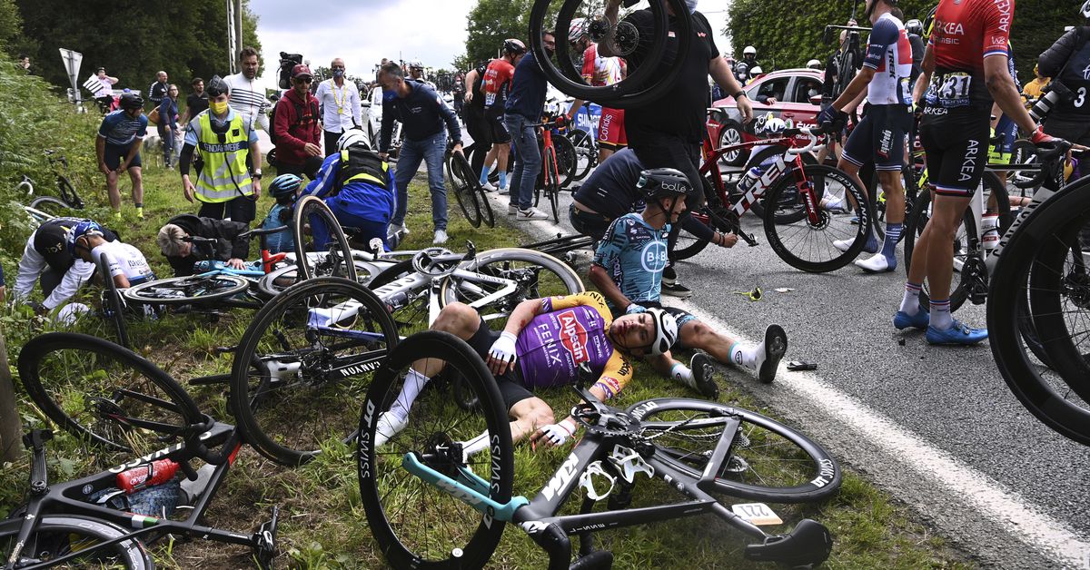 Riders stage protest amid Tour de France road safety
concerns 1