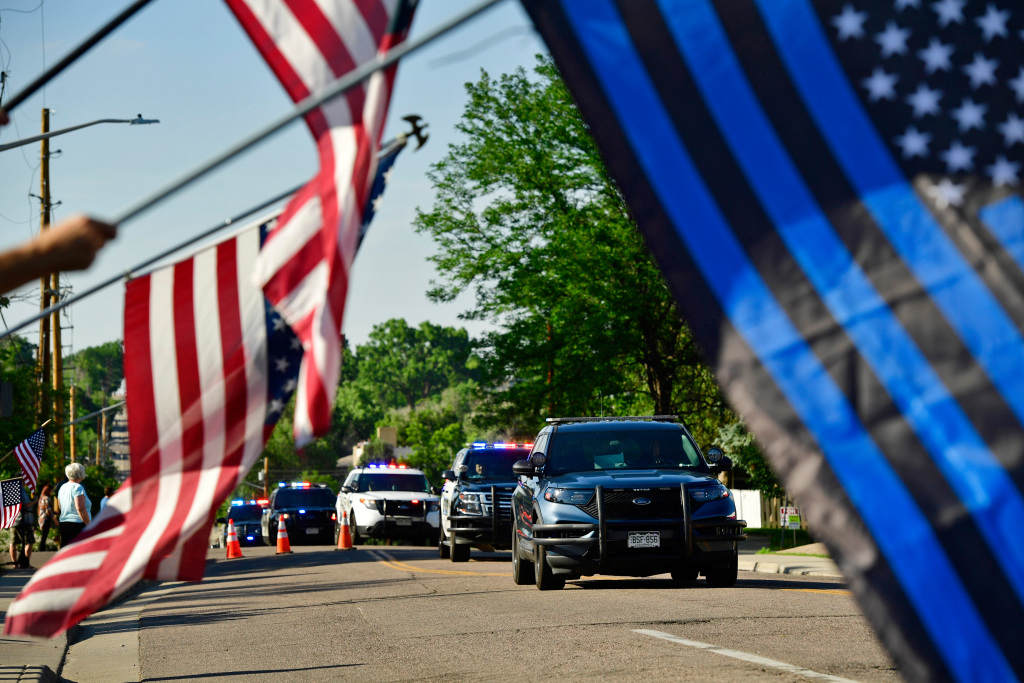 PHOTOS: Slain Arvada police officer honored with procession
by law enforcement, community members 1