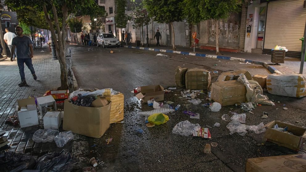 Palestinian forces disperse protest over activist's
death 1
