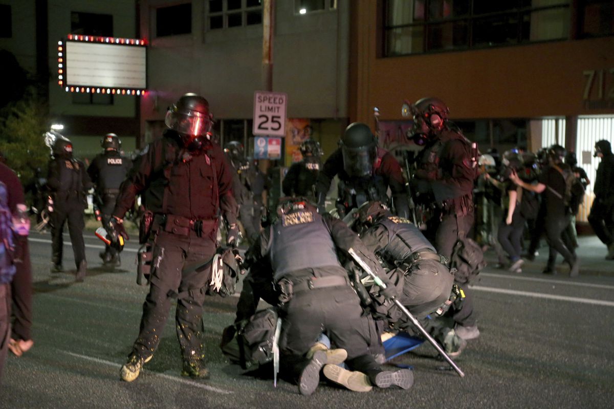 Portland police officer charged with assault of
photojournalist during 2020 protest 1