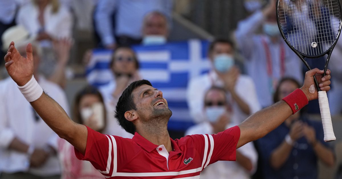 Djokovic tops Tsitsipas in 5 at French Open for 19th
major 1