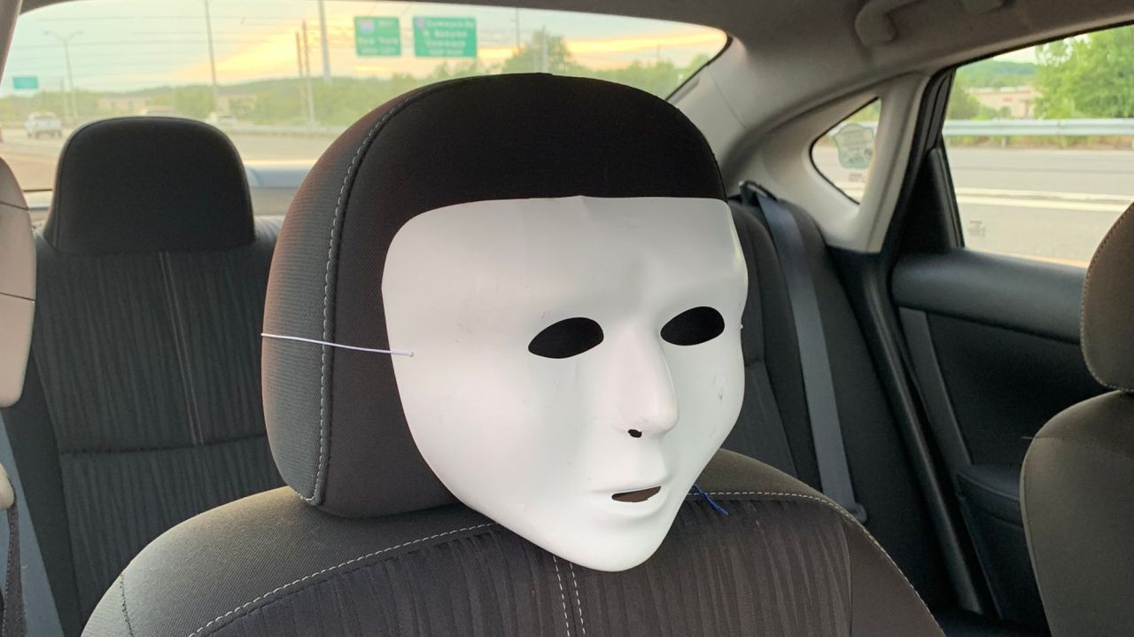 The HOV passenger role was played by a mask, Suffolk police
say 1