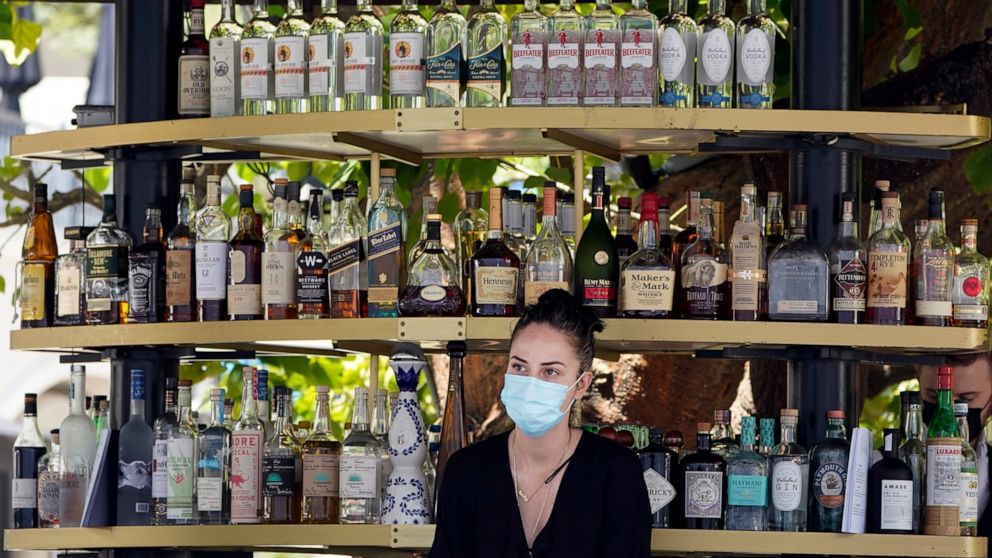 Most California workers to stay masked under revised
rules 1