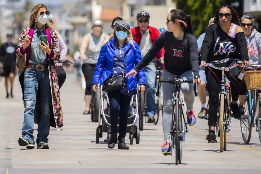 Cal/OSHA will propose allowing vaccinated workers to stop
wearing masks 1