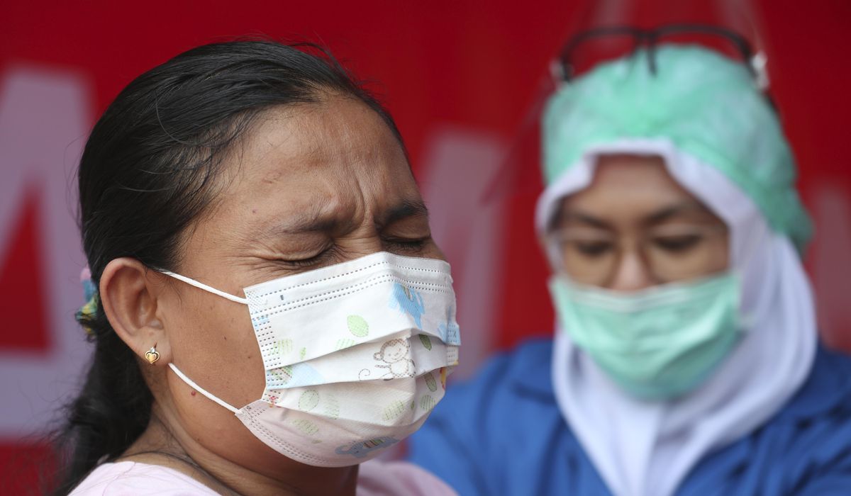 Asia welcomes U.S. COVID-19 vaccine donations amid cold
storage worries 1
