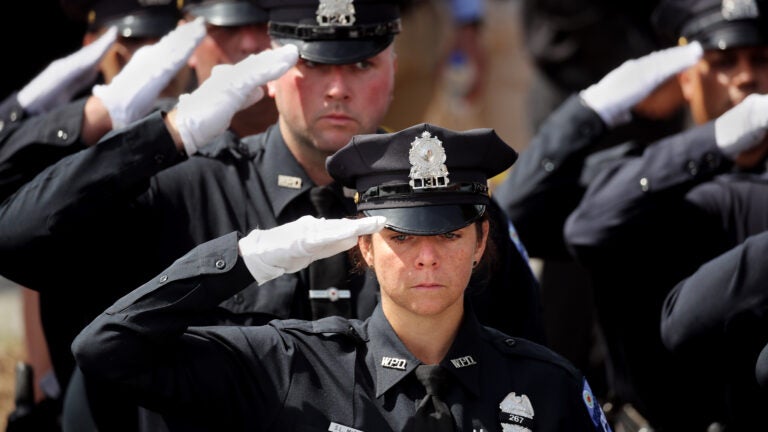 City honors officer who died trying to save drowning
boy 1
