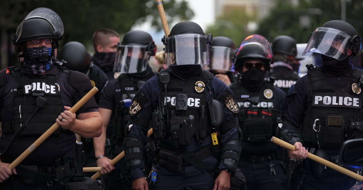 Feds charge Louisville police officer accused of striking
kneeling protester with riot baton 1