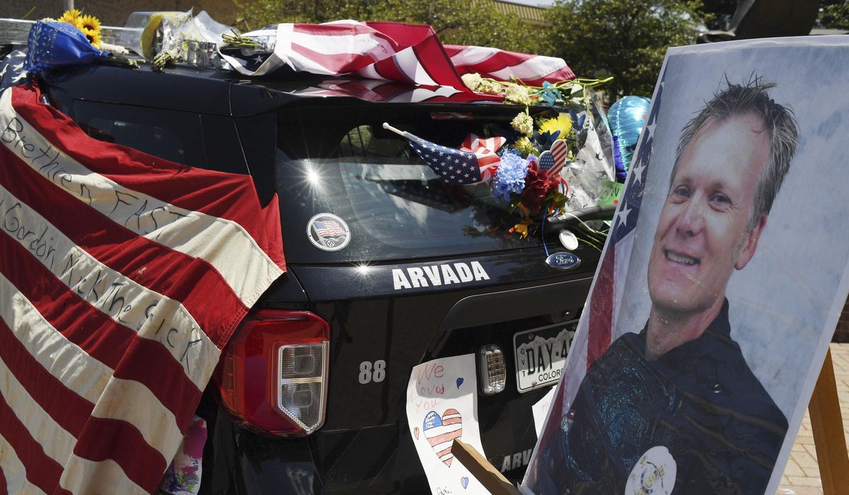 Police: Man who shot Colorado gunman was killed by
officer 1