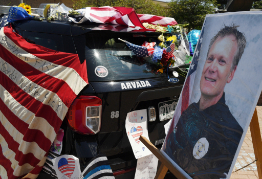 Police: Man who shot Colorado gunman was killed by
officer 1