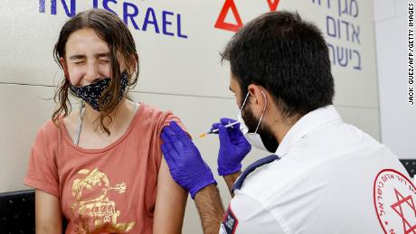 Israel to offer third Covid-19 vaccine dose to people over
60 1