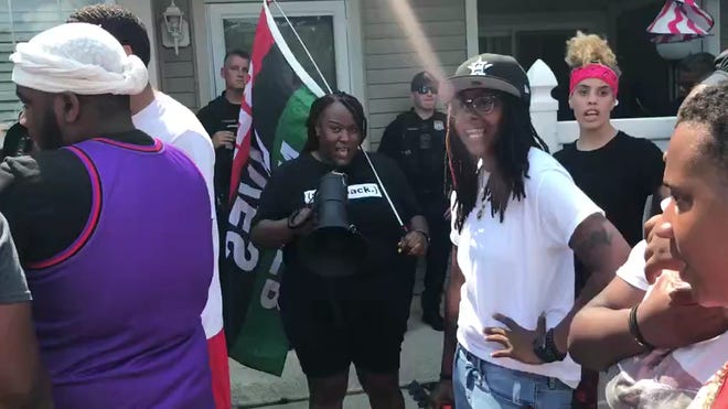 White man who pushed Black neighbor in racist rant arrested
after protesters show up at his home 1