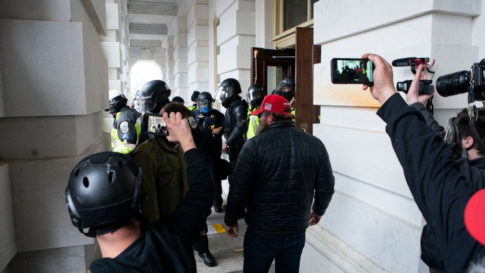 Rioters accused of erasing content from social media,
phones 1