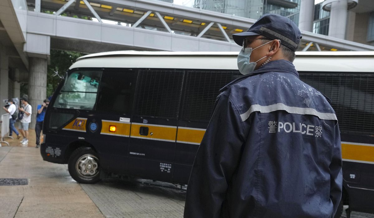 Hong Kong protester given 9-year term in 1st security
case 1