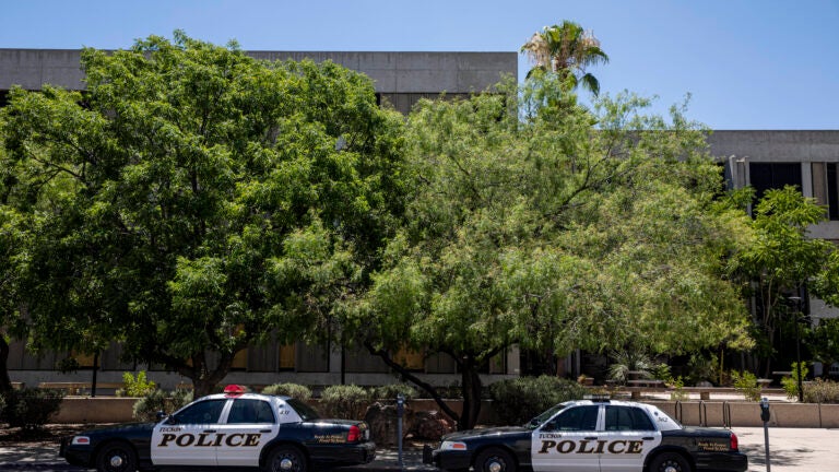 As a house fire blazed, police say a gunman opened fire on
paramedics and firefighters in Tucson 1